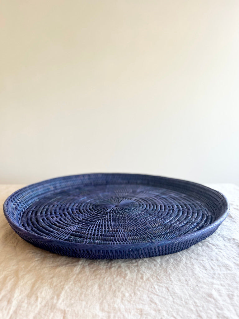 blue round woven tray thirty inches side view