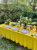 chartreuse linen napkin with macrame edge 18 inches square on table outside