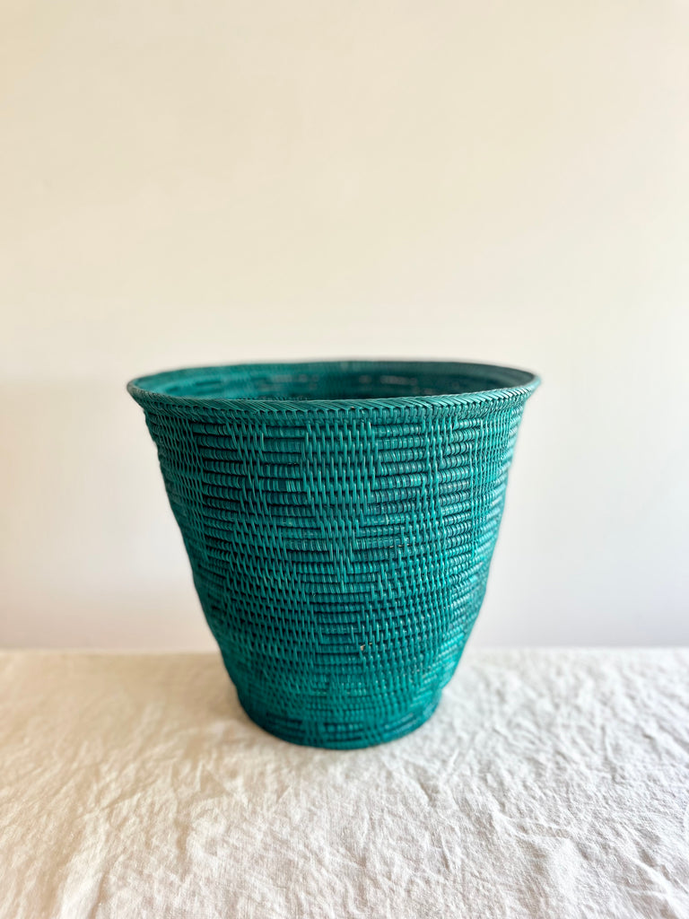 green hand woven wastebasket side view