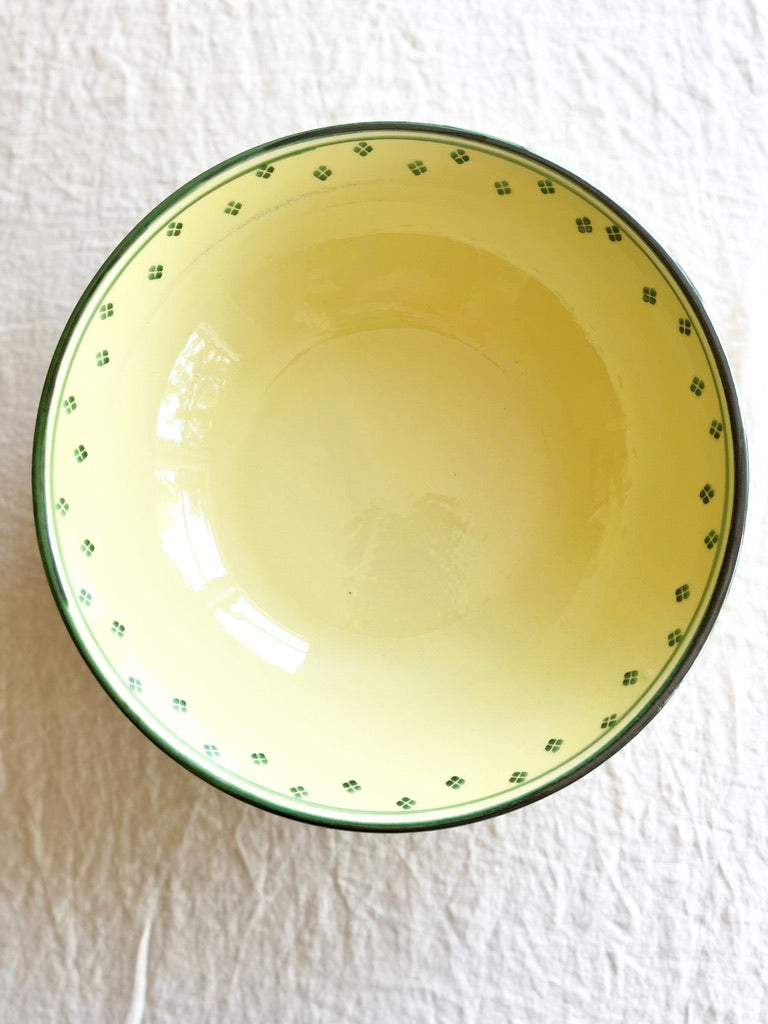 hand painted serving bowl with green rim and dots around edge
