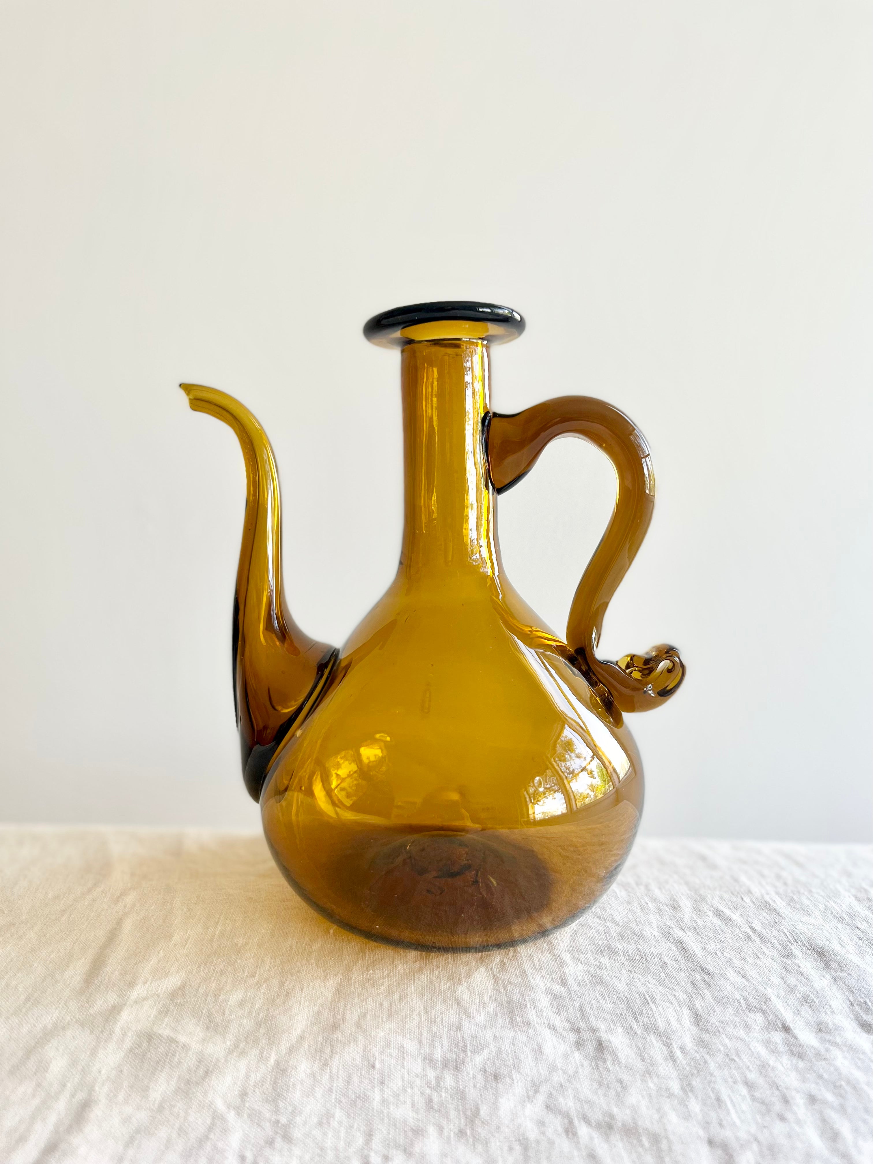 blown glass cruet by gordiola tobacco color close up