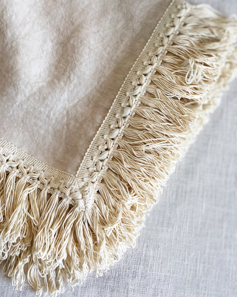 ivory linen napkins with fringe detail view