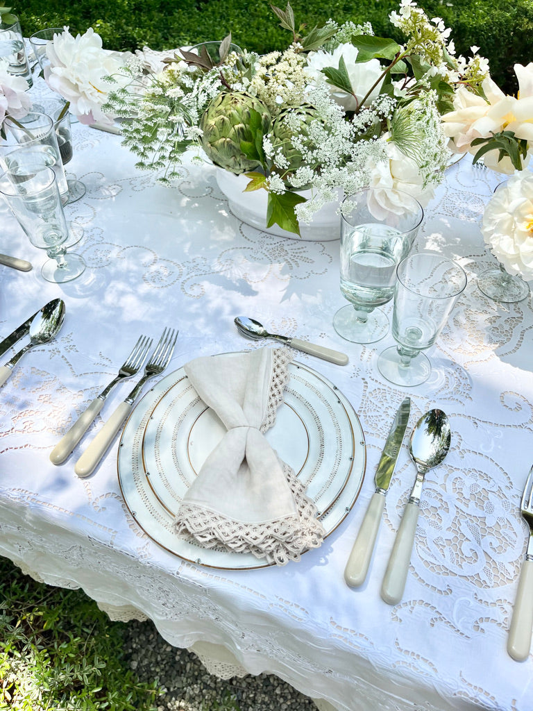 white jardiniere planter with scalloped edge in tablescape