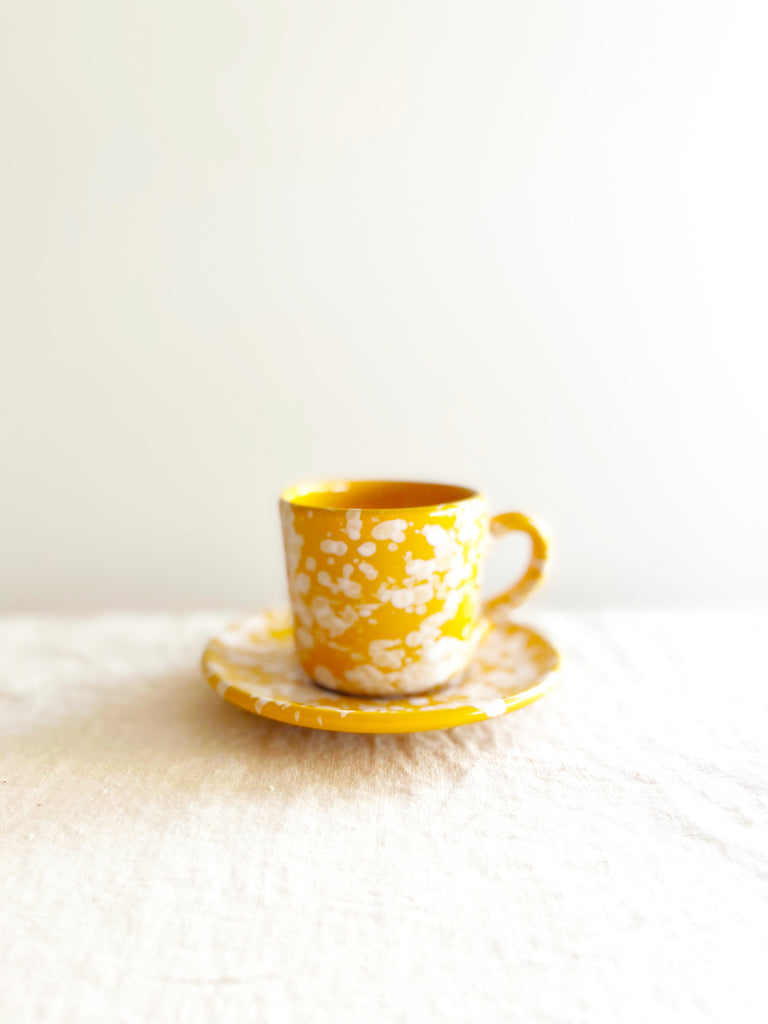 yellow fasano espresso cup with white splatter pattern