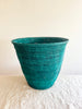 green hand woven wastebasket