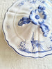 white covered serving dish with blue phoenix design lid detail