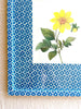 blue and white diamond print paper wrapped frame and mat with yellow botanical print 15" by 19" detail view