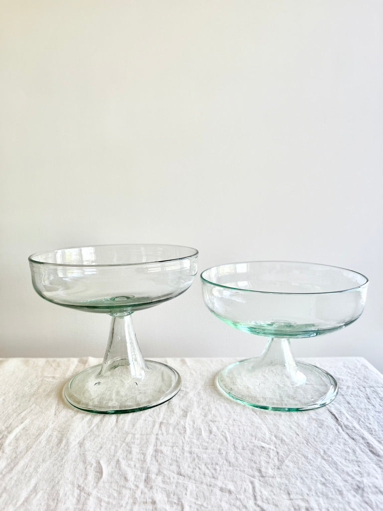 blown glass bowl two sizes on table footed clear aria