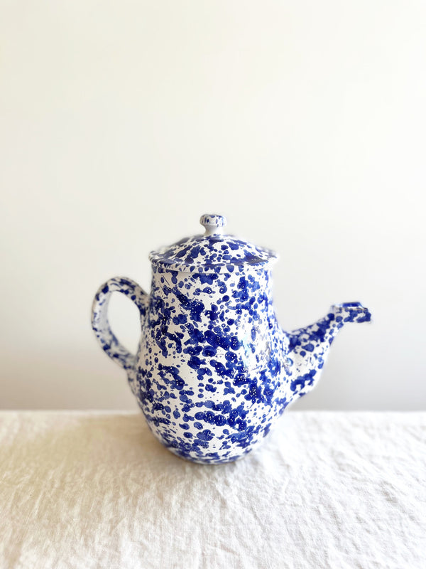 white coffee pot with blue speckled pattern side view