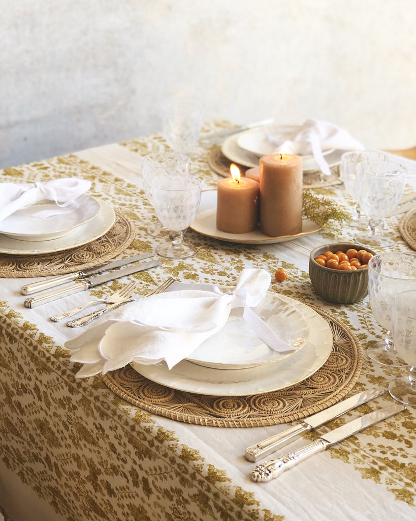 light brown woven charger made from seagrass 12.5 inches in diameter in tablescape