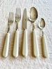 sabre stainless steel flatware set with white resin handle vertical angle view