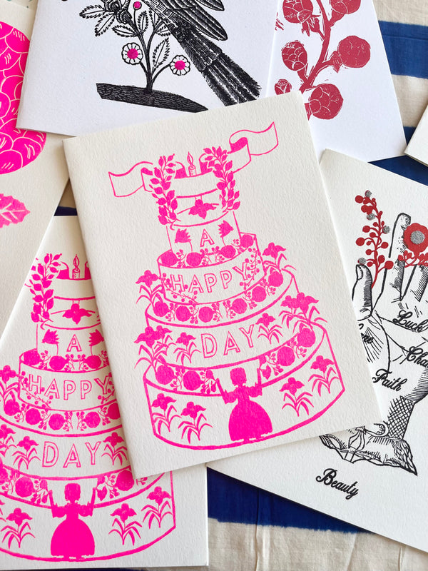 block print hand made card pink and white tiered birthday cake design 7.25" by 10" on table