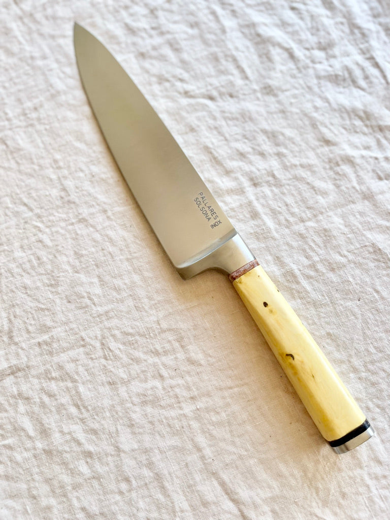 chef knife with boxwood handle on white table by palleras solsona 20cm