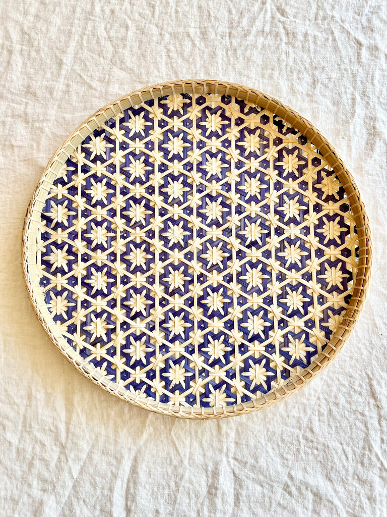 light tan woven tray with navy blue mosaic star pattern 12 inches