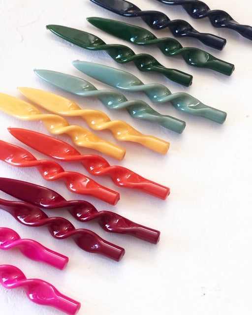 dark green twisted taper candles group of many different colors