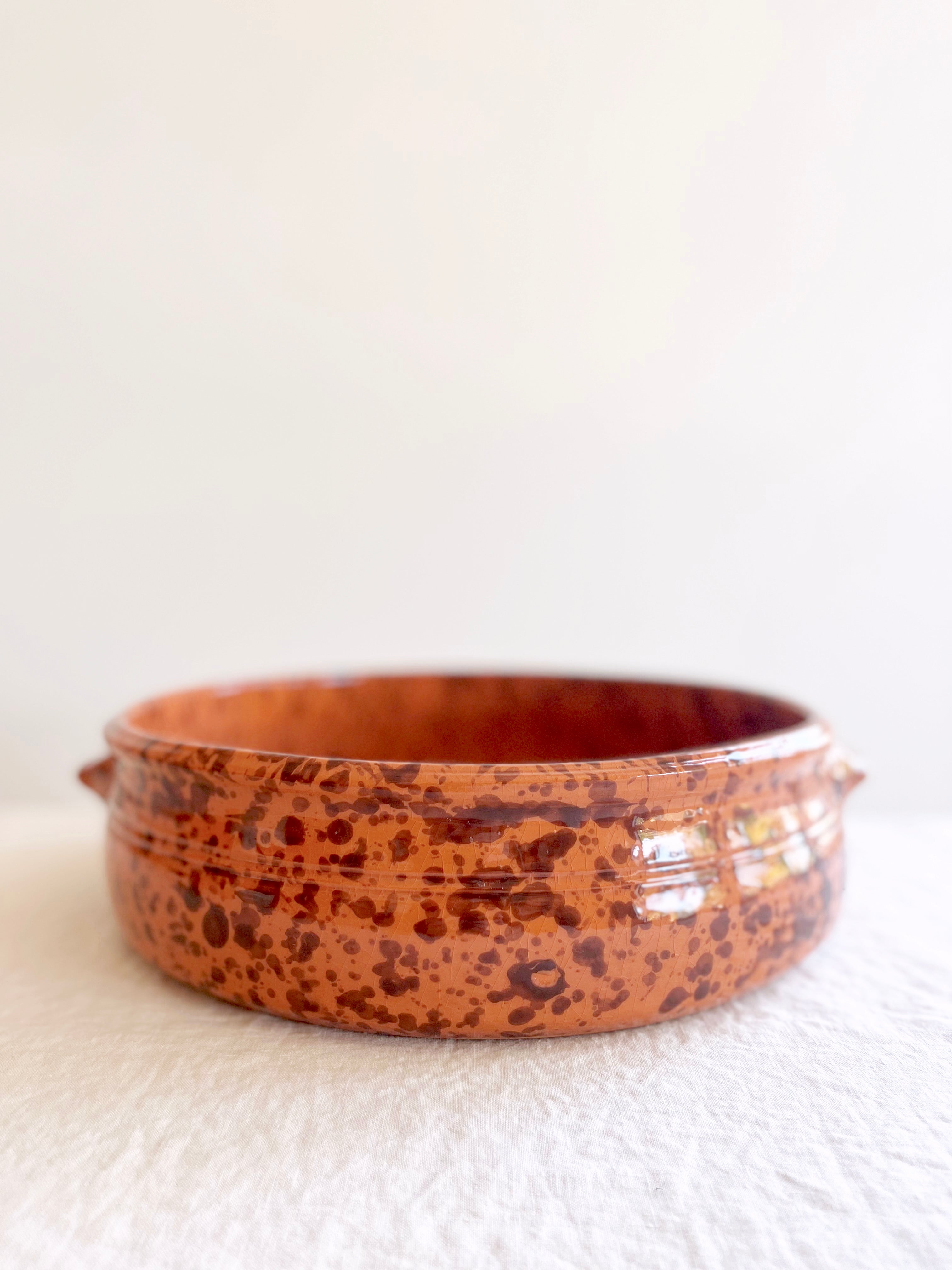 brown round oven safe dish with dark brown speckle pattern 12.5" diameter side view