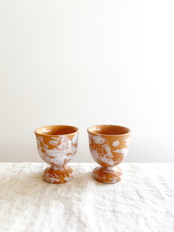 fasano egg cups with splatter pattern in sienna