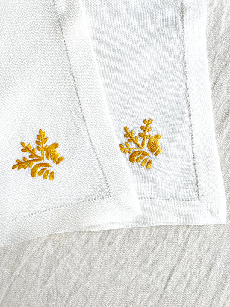 white hand embroidered linen napkins with gold corn stalk in corner 16 inches square set of two