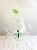 clear hand blown glass teapot with white glass lotus flower in bottom