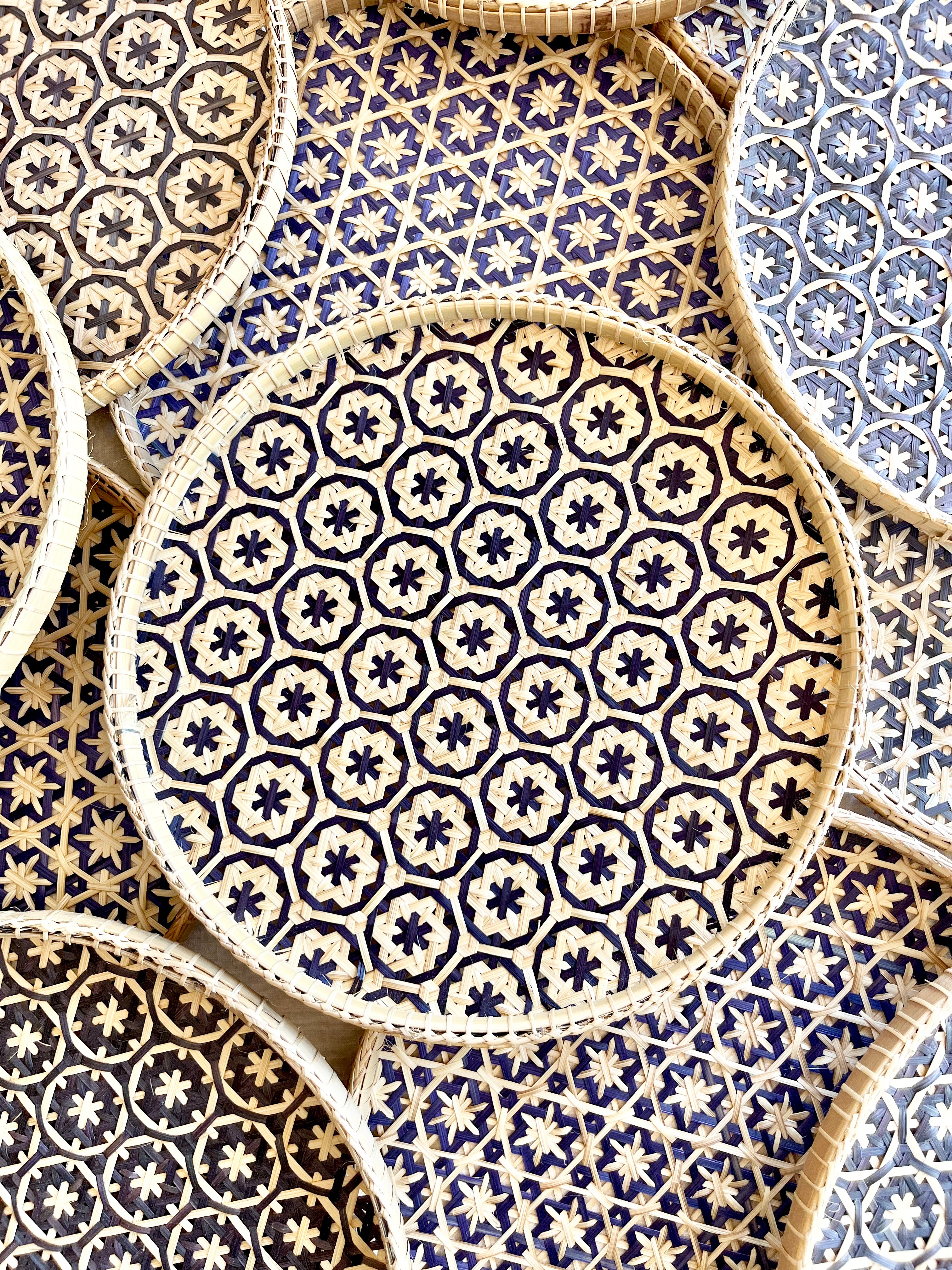 light tan woven tray with navy blue mosaic flower pattern 12 inches detail view