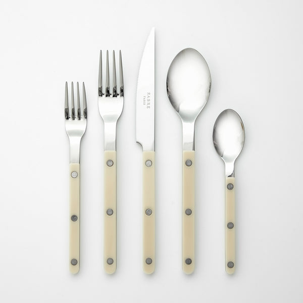 sabre stainless steel flatware set with cream resin handles