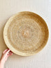 round woven tray thirty inches on white table