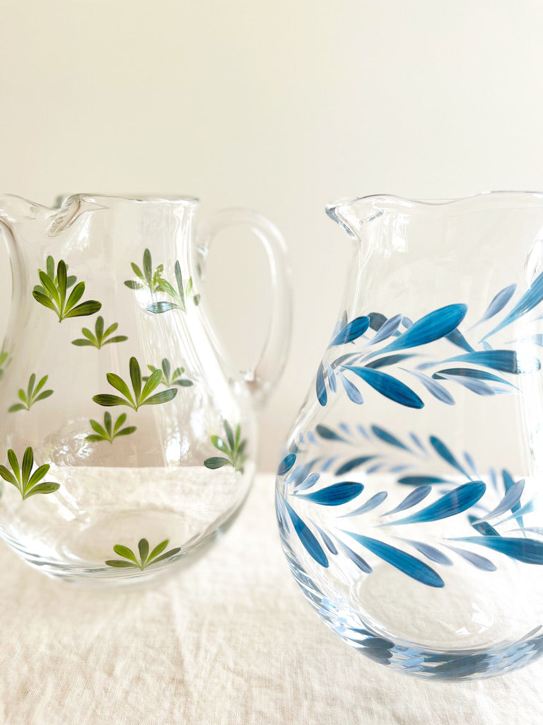 glass pitcher with hand painted blue leaf pattern 8 inches tall group of two