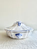 white covered serving dish with blue phoenix design side view