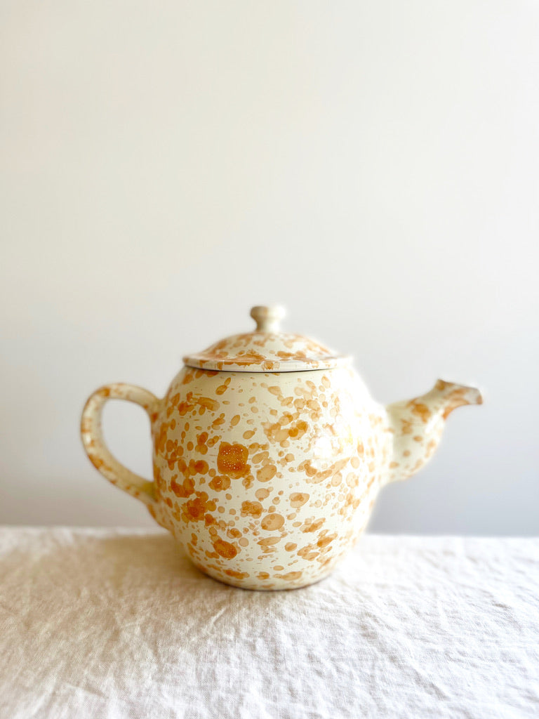 teapot with splatter pattern in natural color side view