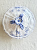 white covered serving dish with blue phoenix design top view
