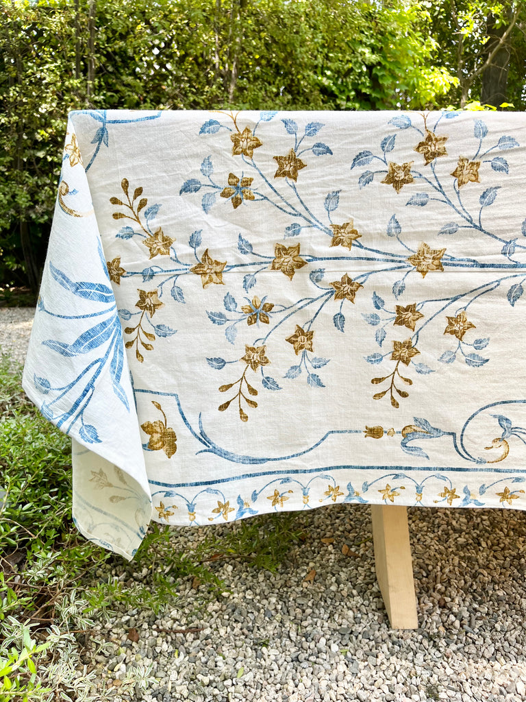 white tablecloth with blue and brown floral pattern detail view