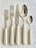 sabre stainless steel flatware set with white resin handle detail