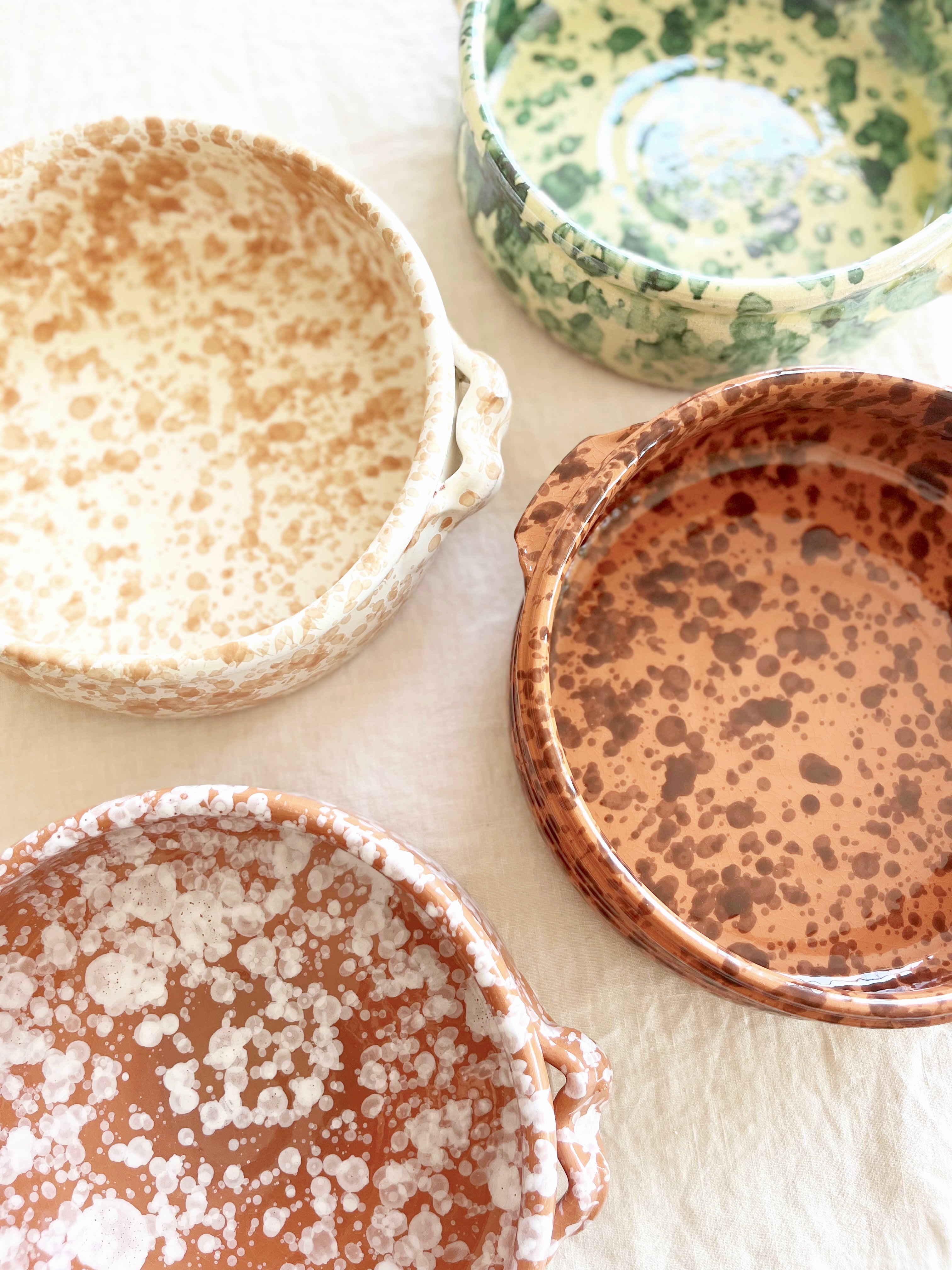 round oven safe dish in cream with green speckle pattern 9" diameter shown with other color options