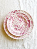 cream fasano salad plate with pink speckle pattern with dinner plate