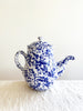 white coffee pot with blue speckled pattern 