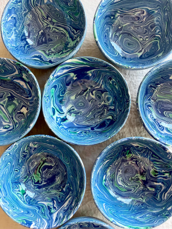 finger bowls with blue green and white swirl pattern 4 inches in diameter top view