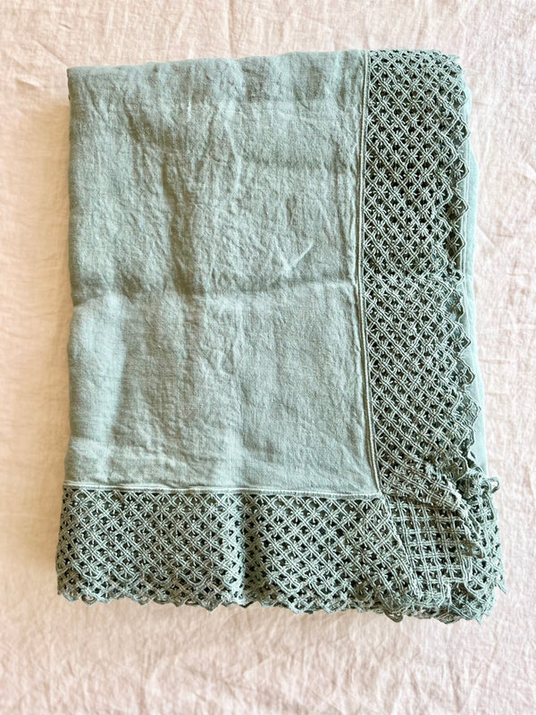 sage green linen tablecloth with macrame trim