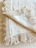 cream linen tablecloth with macrame trim close up of trim