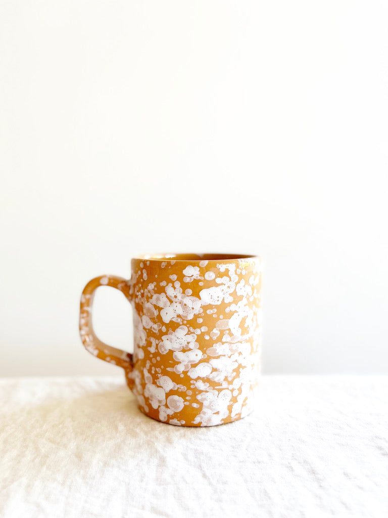 coffee mugs with splatter pattern in sienna color side view