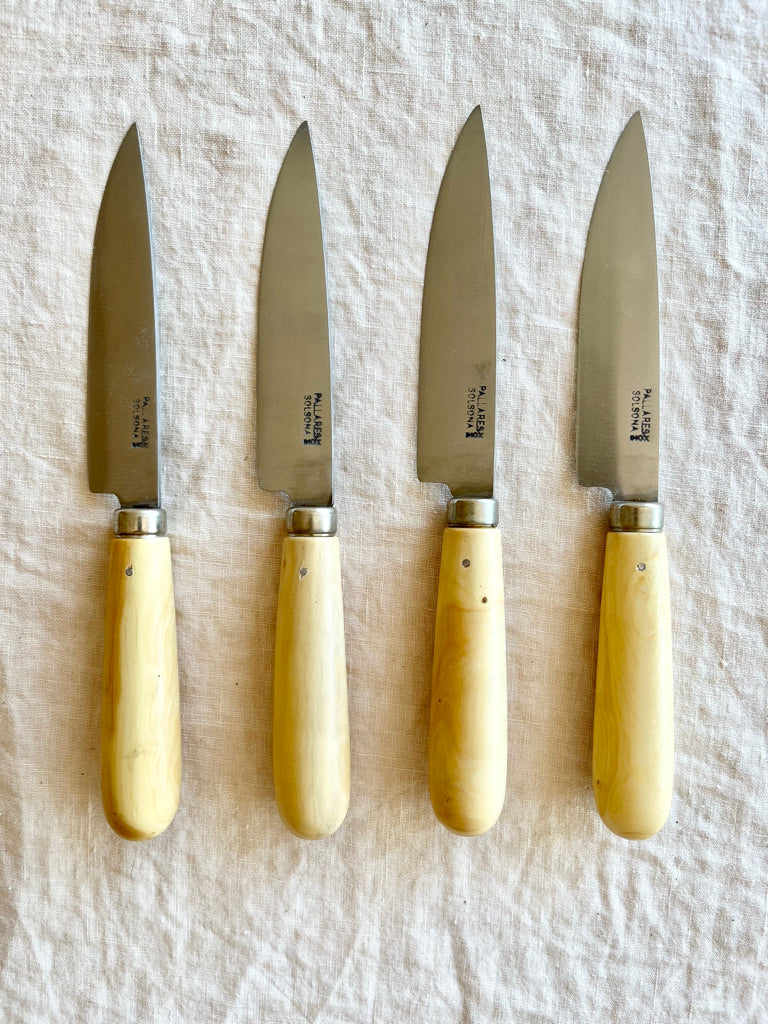 kitchen knife with boxwood handle by pallares solsona carbon steel 10cm group on white table