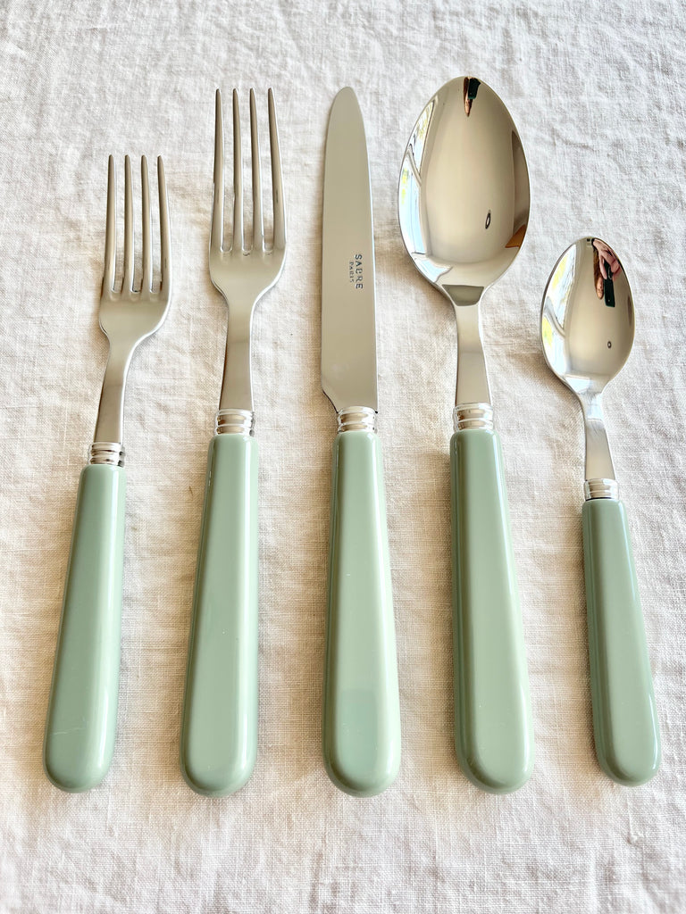 sabre stainless steel flatware set with sage green resin handle detail view