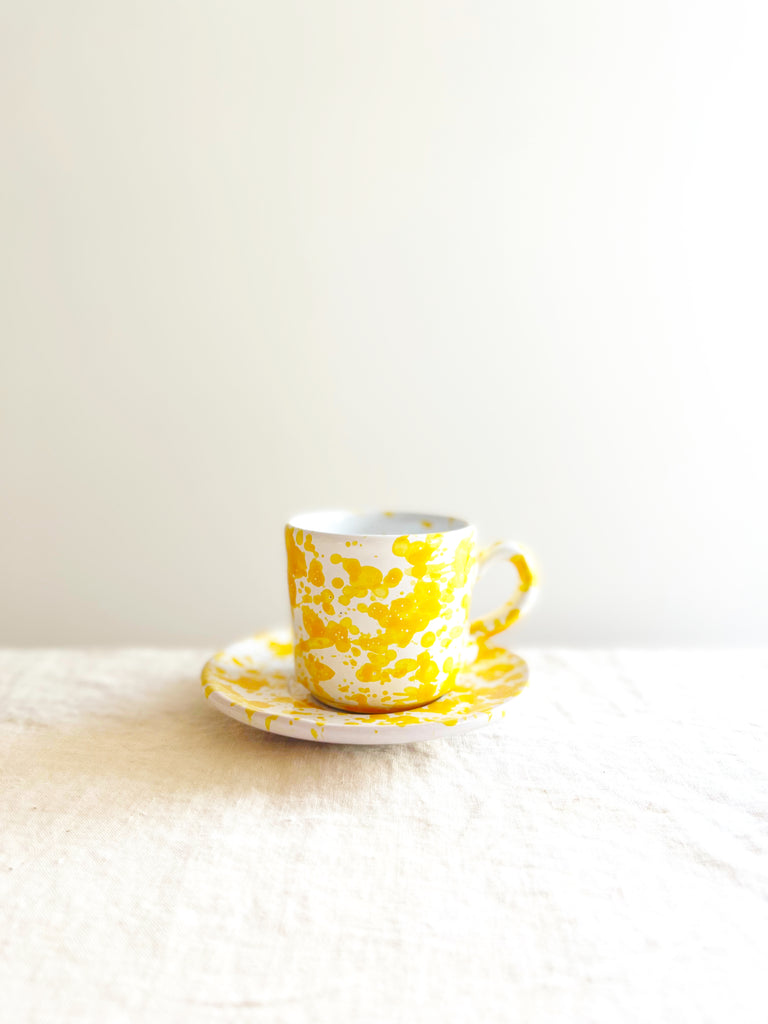 white fasano espresso cup with yellow splatter pattern