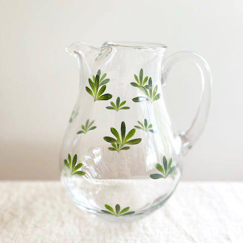 glass pitcher with dark green leaf pattern