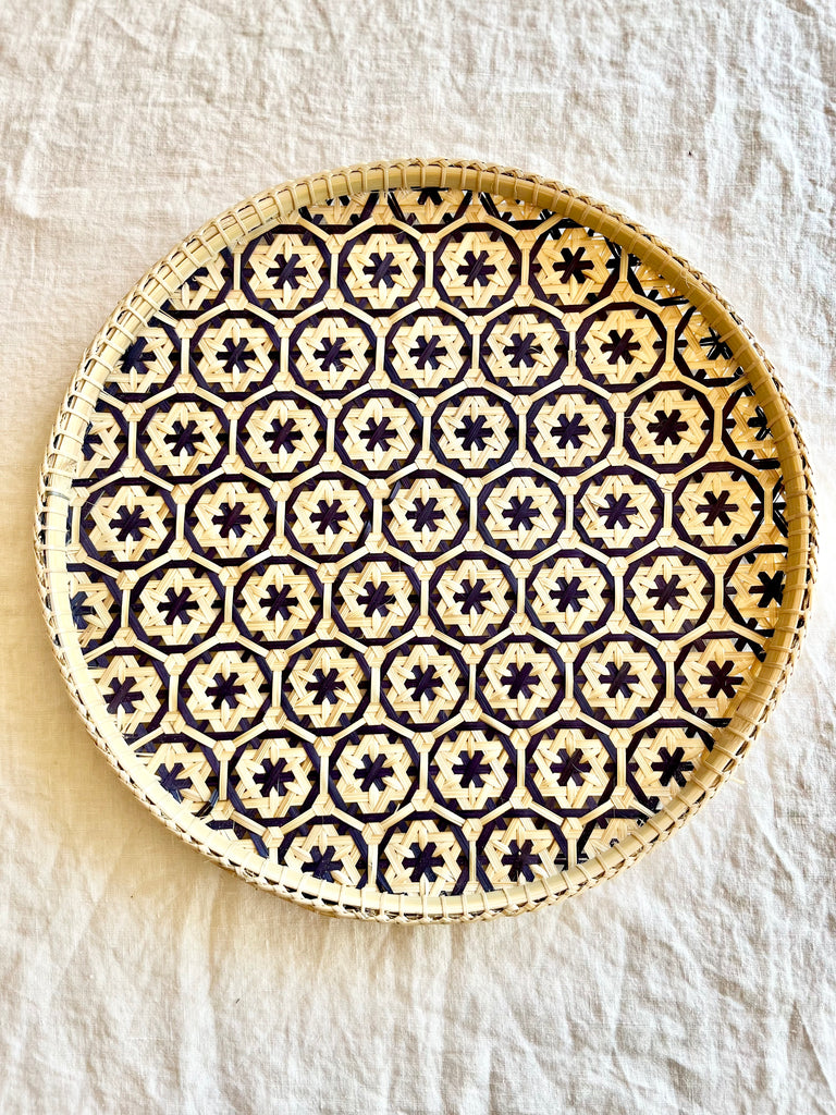 light tan woven tray with navy blue mosaic flower pattern 12 inches