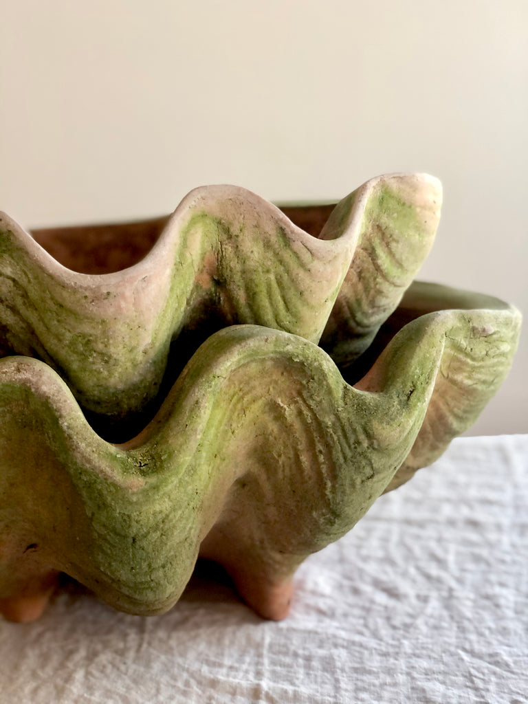 clam shell terra cotta planter with moss edge detail