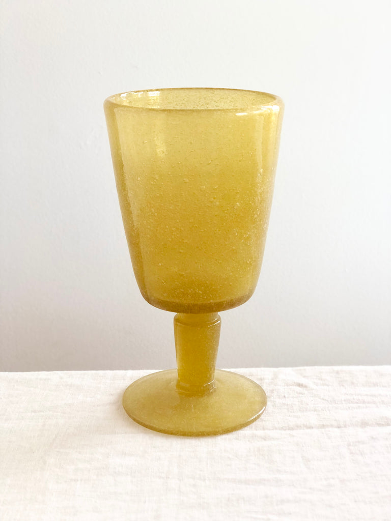 goblet made of yellow bubble glass detail view