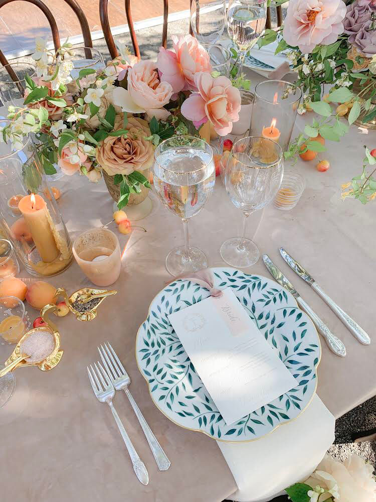 hand painted limoges porcelain dinner plate with green vine pattern and gold rim in place setting