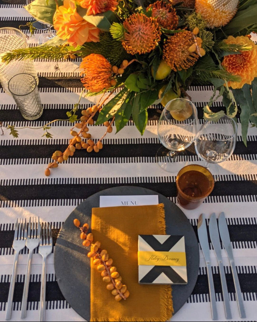 bubble glass tumbler in amber color in placesetting