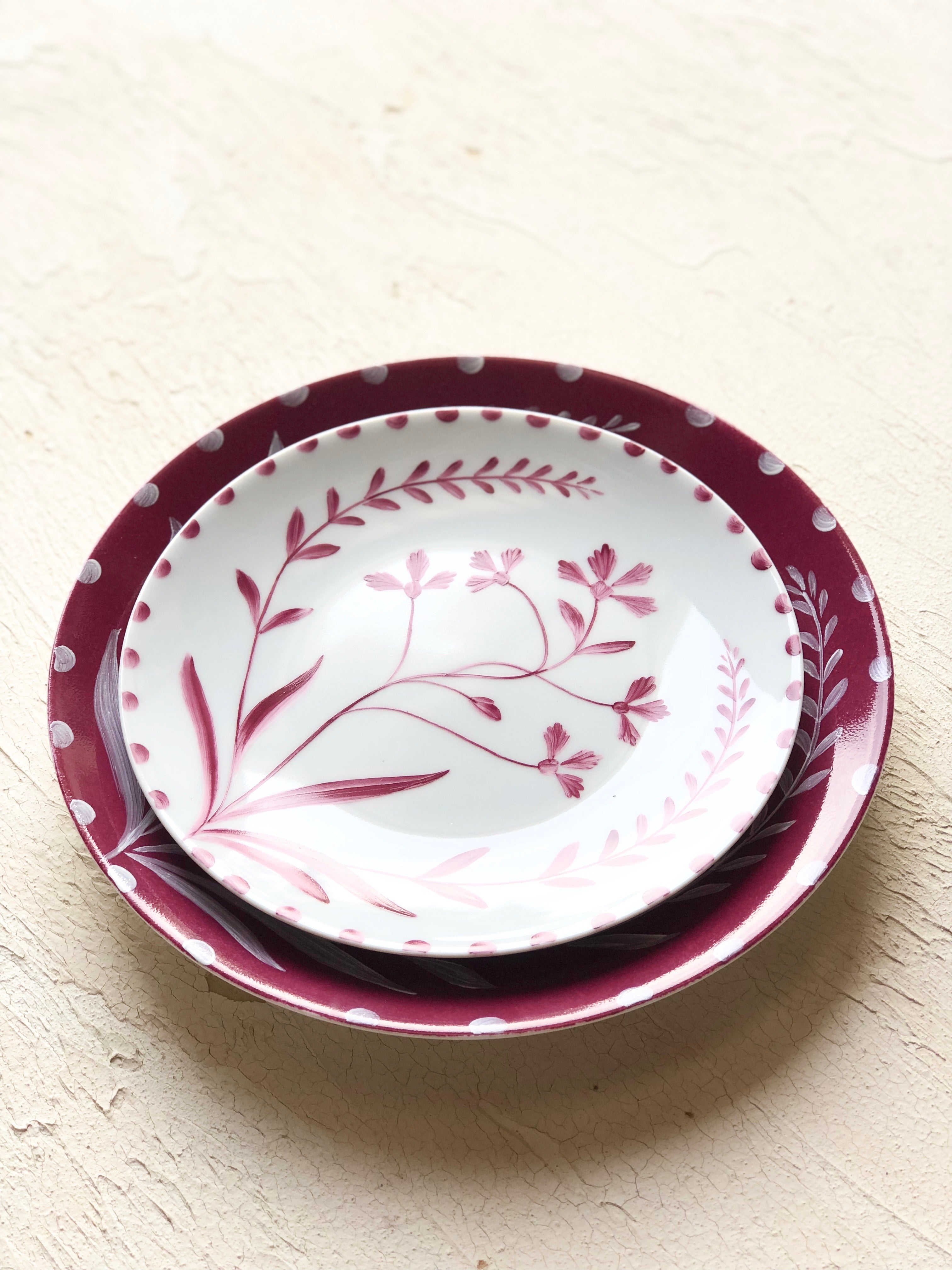 white dinner plate with ruby hand painted floral 10.5 inch stacked angle view