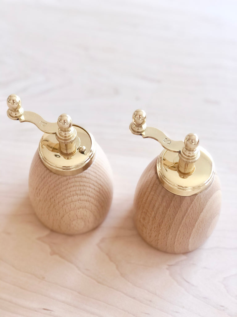 wood salt and pepper mills with brass top view